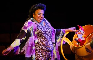 5 - Rina Fatania as Mrs Peachum in Dead Dog in a Suitcase (and other love songs) by Kneehigh Theatre @ HOME Manchester (11-26 Sept 2015). Photo (c) Steve Tanner